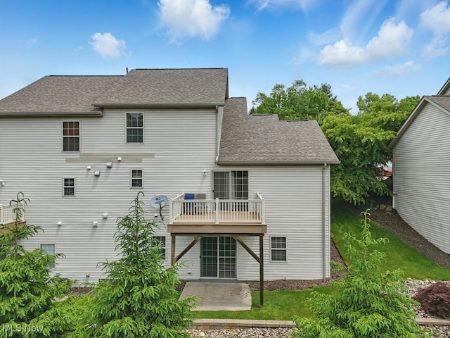 91 Falling Water Cir, Munroe Falls, OH 44262 - rear view of house with a shingled roof and a patio