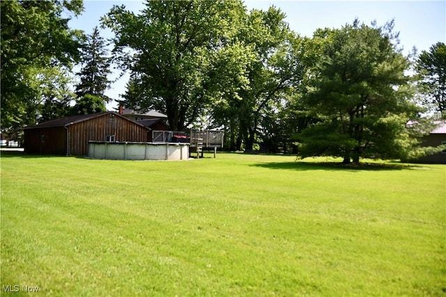5041 W S Range Rd, Salem, OH 44460 - view of green lawn featuring a covered pool and a deck