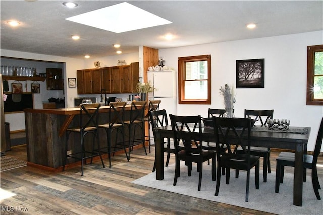 5041 W S Range Rd, Salem, OH 44460 - dining space featuring dark wood finished floors, a skylight, and recessed lighting
