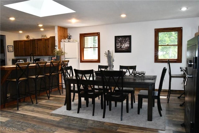 5041 W S Range Rd, Salem, OH 44460 - dining area featuring dark wood-type flooring, a skylight, and recessed lighting