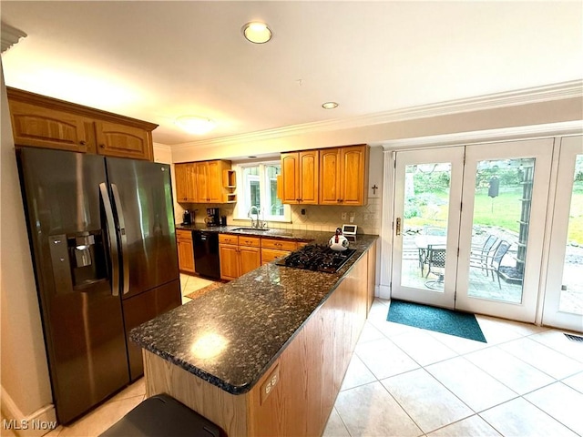 15217 Fox Run, Chagrin Falls, OH 44022 - kitchen with black appliances, brown cabinetry, crown molding, dark stone countertops, and light tile patterned floors