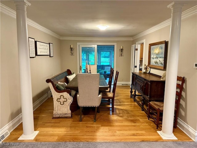 15217 Fox Run, Chagrin Falls, OH 44022 - dining space with decorative columns, light wood-type flooring, and ornamental molding