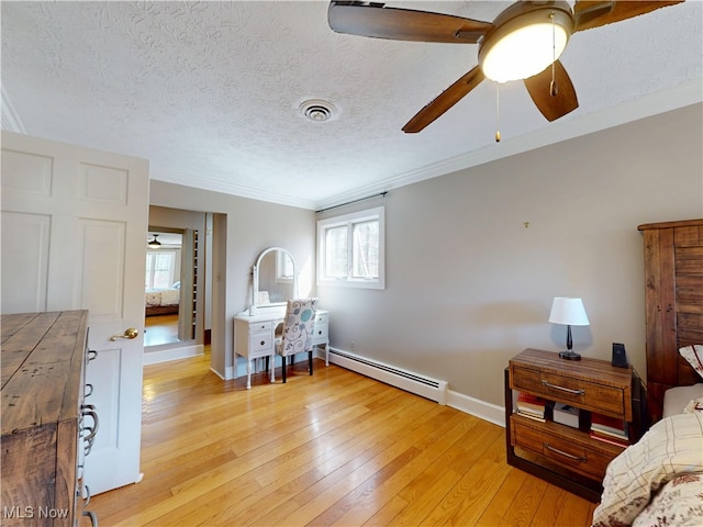 15217 Fox Run, Chagrin Falls, OH 44022 - bedroom with a baseboard radiator, crown molding, light wood finished floors, a textured ceiling, and a ceiling fan