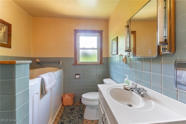 6567 Mount Everett Rd, Hubbard, OH 44425 - bathroom featuring tile walls, a garden tub, vanity, wainscoting, and tile patterned flooring