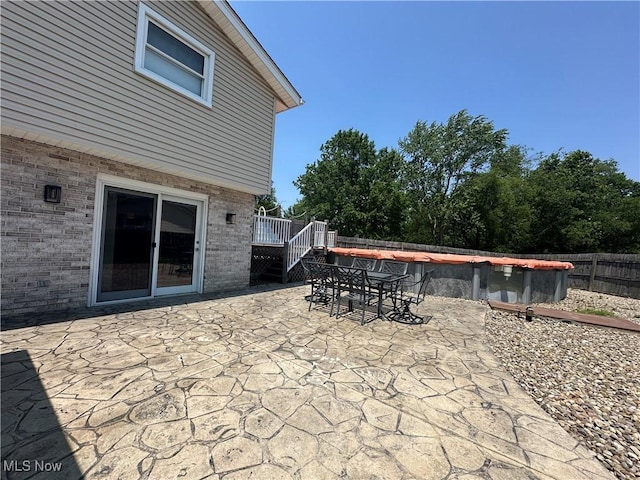 3005 Chaucer Dr NE, Canton, OH 44721 - view of patio / terrace featuring outdoor dining area, a wooden deck, and stairs