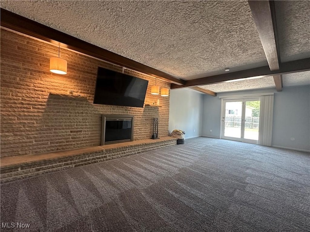 3005 Chaucer Dr NE, Canton, OH 44721 - unfurnished living room featuring a textured ceiling, carpet flooring, beamed ceiling, and a brick fireplace