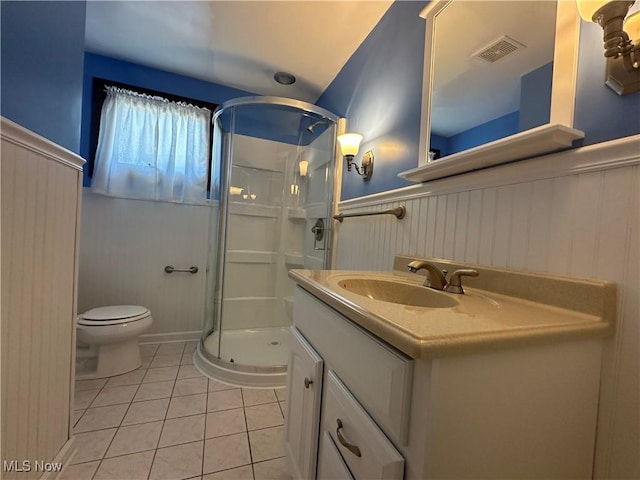 3005 Chaucer Dr NE, Canton, OH 44721 - bathroom with wainscoting, tile patterned floors, a stall shower, and vanity