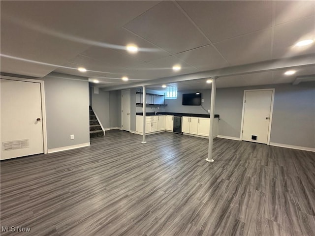 3005 Chaucer Dr NE, Canton, OH 44721 - below grade area with dark wood-type flooring and stairway