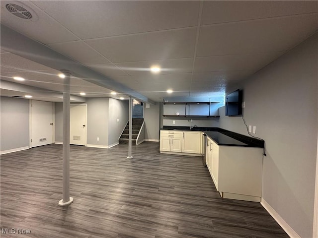 3005 Chaucer Dr NE, Canton, OH 44721 - finished basement with dark wood-type flooring and stairway