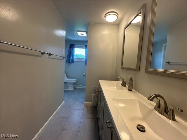 3005 Chaucer Dr NE, Canton, OH 44721 - bathroom with tile patterned flooring and double vanity