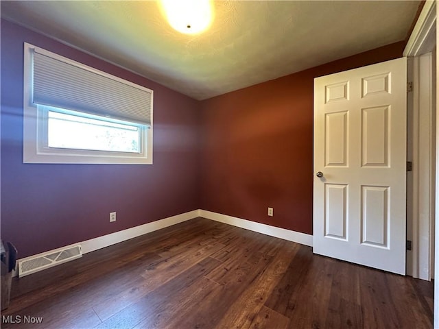 3005 Chaucer Dr NE, Canton, OH 44721 - empty room featuring dark wood-style floors