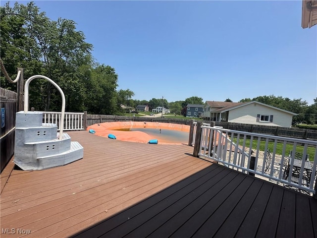 3005 Chaucer Dr NE, Canton, OH 44721 - wooden deck with a fenced backyard
