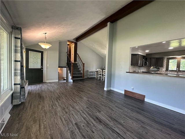 3005 Chaucer Dr NE, Canton, OH 44721 - unfurnished living room featuring dark wood-style floors, stairway, and recessed lighting