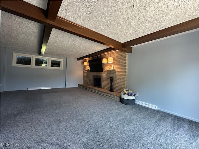 3005 Chaucer Dr NE, Canton, OH 44721 - unfurnished living room with a textured ceiling, beam ceiling, a fireplace, carpet floors, and baseboard heating