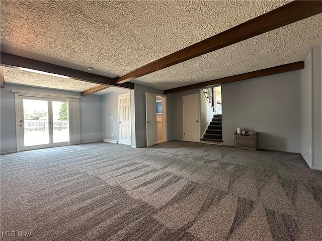 3005 Chaucer Dr NE, Canton, OH 44721 - empty room with a textured ceiling, carpet floors, stairway, and beamed ceiling