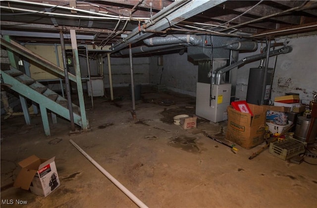 774 Storer Ave, Akron, OH 44320 - unfinished below grade area with gas water heater, stairs, and heating unit