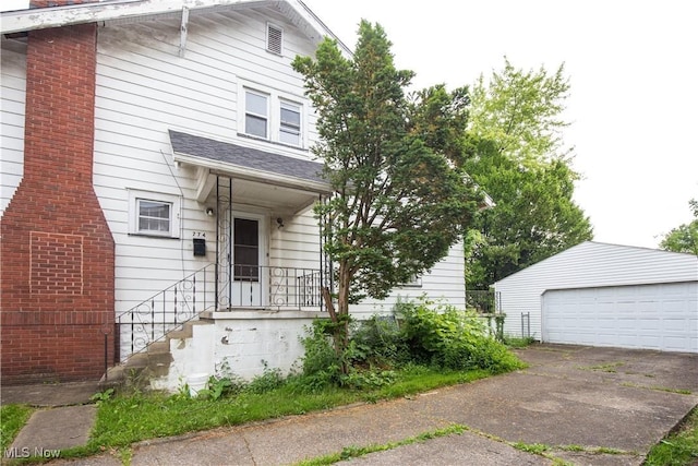 774 Storer Ave, Akron, OH 44320 - view of front of house with an outdoor structure and a detached garage