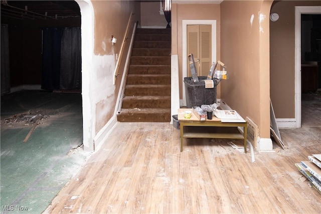 774 Storer Ave, Akron, OH 44320 - stairway featuring arched walkways and wood finished floors