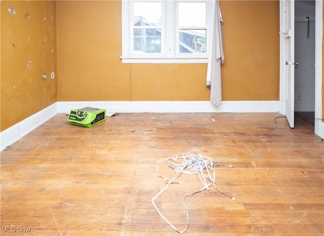 774 Storer Ave, Akron, OH 44320 - unfurnished room featuring wood finished floors and baseboards
