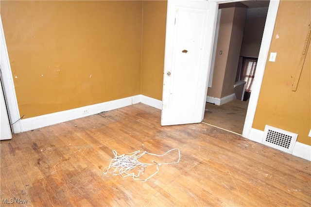 774 Storer Ave, Akron, OH 44320 - unfurnished bedroom with hardwood / wood-style flooring and baseboards