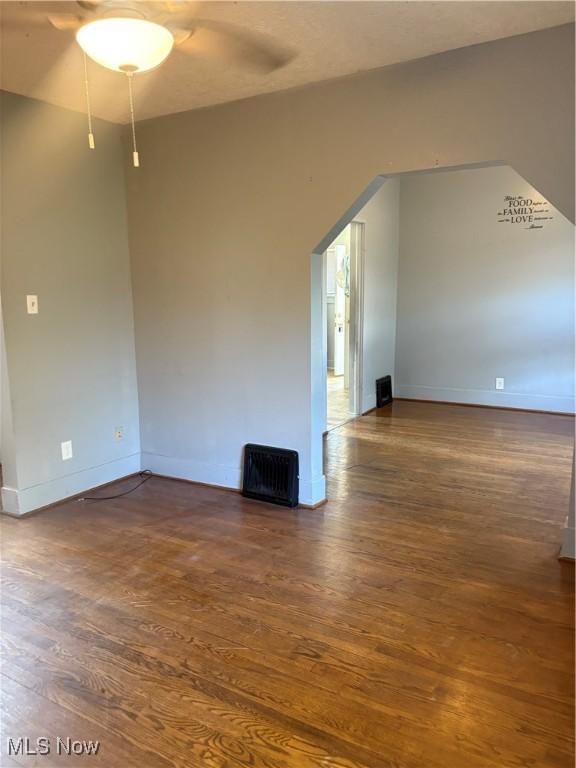 11 Front St, Rittman, OH 44270 - unfurnished room with wood finished floors and a ceiling fan