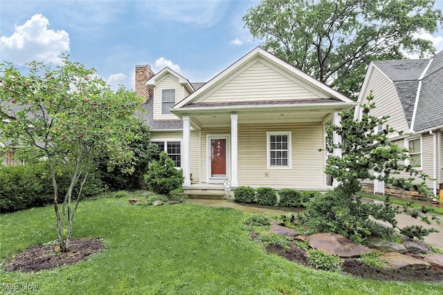 3514 Muriel Ave, Old Brooklyn, OH 44109 - view of front of house featuring covered porch, a chimney, and a front lawn