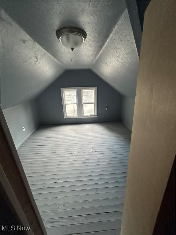 3351 E 65th St, Cleveland, OH 44127 - bonus room with a textured ceiling and lofted ceiling