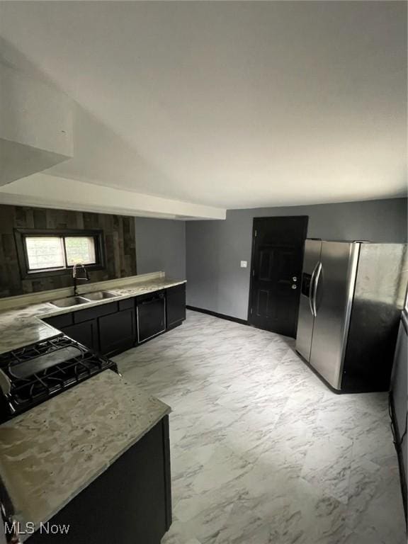 3351 E 65th St, Cleveland, OH 44127 - kitchen with stainless steel fridge and dark cabinetry