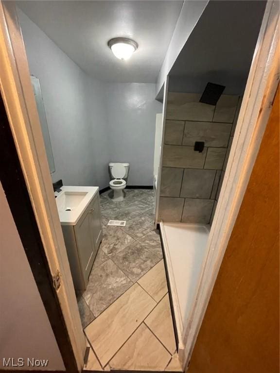 3351 E 65th St, Cleveland, OH 44127 - full bath featuring vanity, tiled shower, and marble finish flooring