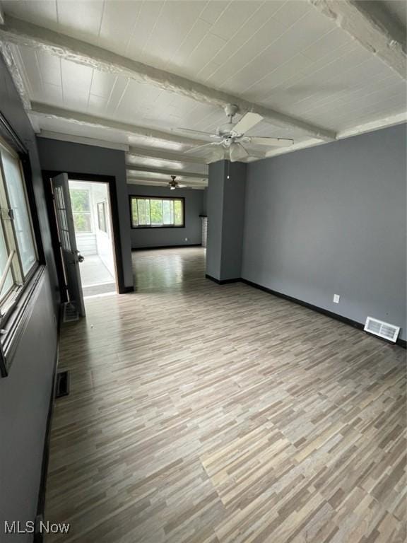 3351 E 65th St, Cleveland, OH 44127 - spare room with a ceiling fan, wood finished floors, and beamed ceiling