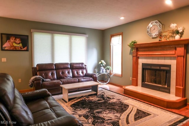 620 Ridgeline Dr, Cuyahoga Falls, OH 44223 - living room with a tile fireplace, wood finished floors, and recessed lighting