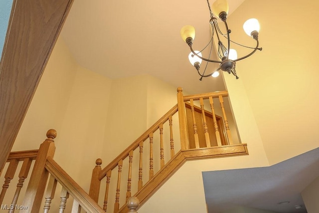 620 Ridgeline Dr, Cuyahoga Falls, OH 44223 - stairs with a chandelier