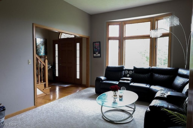 620 Ridgeline Dr, Cuyahoga Falls, OH 44223 - carpeted living area with healthy amount of natural light and stairs