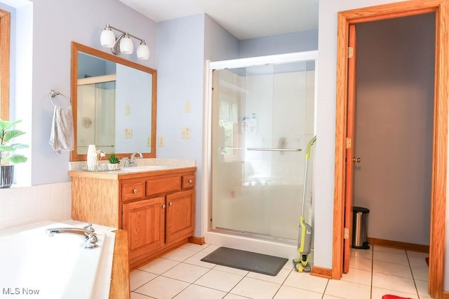 620 Ridgeline Dr, Cuyahoga Falls, OH 44223 - full bathroom featuring vanity, a stall shower, a garden tub, and tile patterned flooring