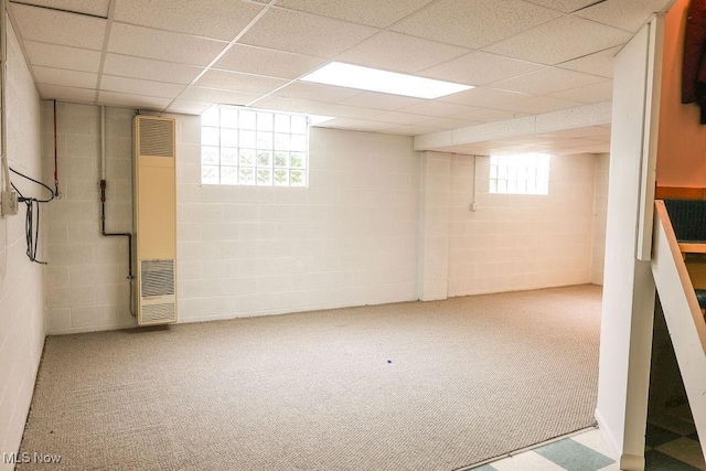 620 Ridgeline Dr, Cuyahoga Falls, OH 44223 - basement featuring a heating unit, carpet flooring, concrete block wall, and a paneled ceiling