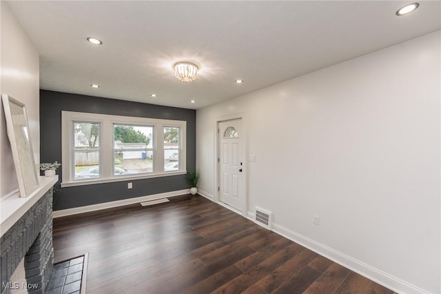 10310 Thrush Ave, Cleveland, OH 44111 - entrance foyer with dark wood finished floors, recessed lighting, and a fireplace