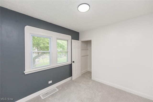 10310 Thrush Ave, Cleveland, OH 44111 - unfurnished bedroom with light carpet and baseboards