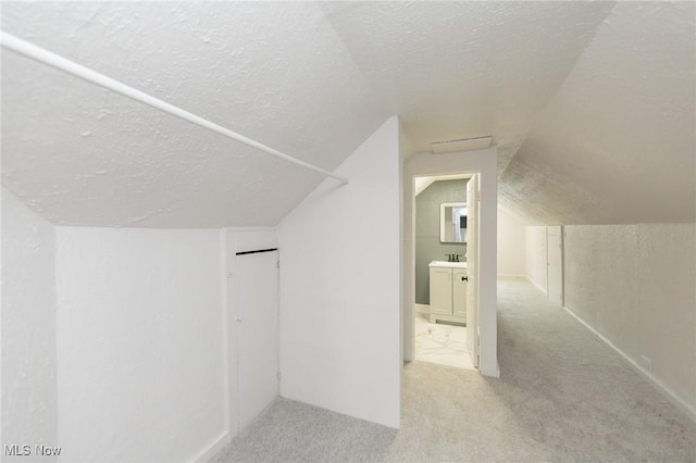 10310 Thrush Ave, Cleveland, OH 44111 - additional living space featuring a textured ceiling, carpet flooring, and lofted ceiling