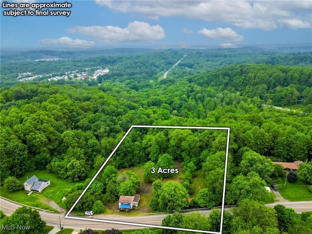 5477 Dueber Ave, East Sparta, OH 44626 - aerial view of property and surrounding area with a heavily wooded area and property parcel outlined