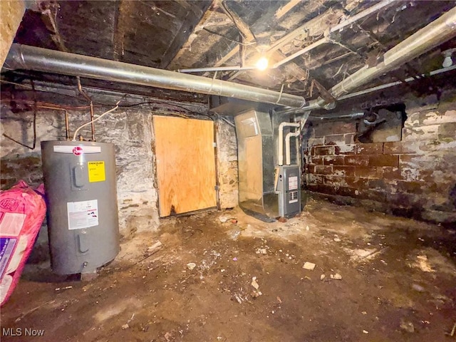 5477 Dueber Ave, East Sparta, OH 44626 - unfinished below grade area featuring electric water heater and heating unit