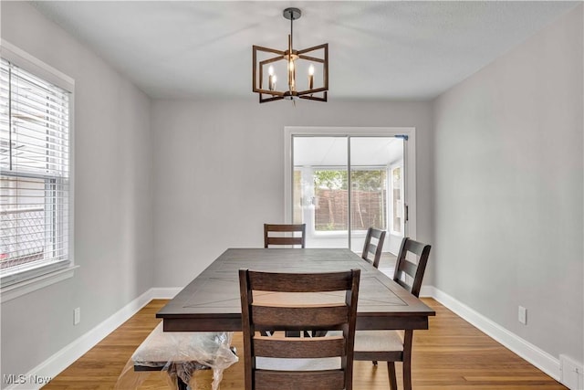 6207 Dartworth Dr, Parma, OH 44129 - dining space with a chandelier and light wood-style floors