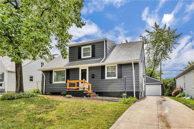 6207 Dartworth Dr, Parma, OH 44129 - bungalow with a garage, a front lawn, an outbuilding, and roof with shingles