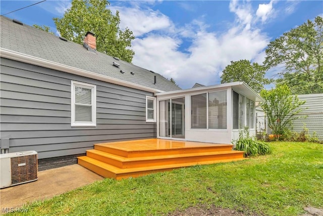 6207 Dartworth Dr, Parma, OH 44129 - rear view of house featuring a sunroom, a deck, a chimney, and a shingled roof