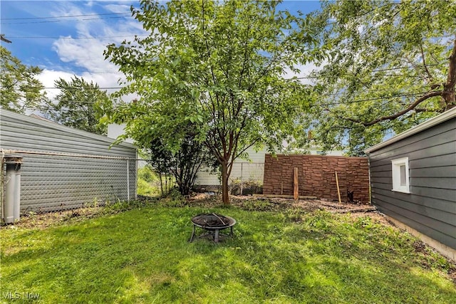 6207 Dartworth Dr, Parma, OH 44129 - view of yard featuring an outdoor fire pit