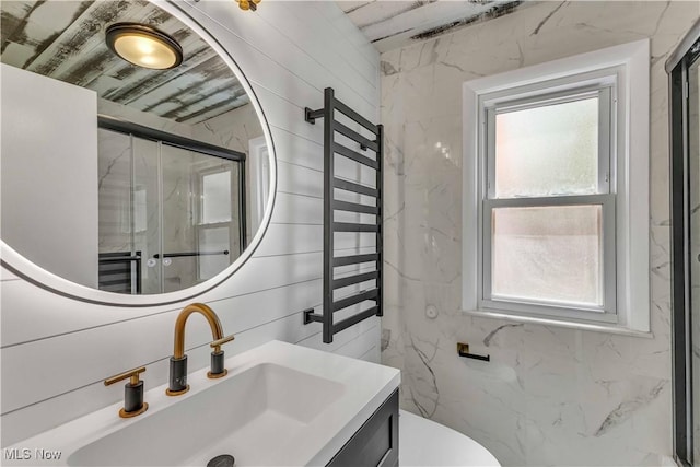 6207 Dartworth Dr, Parma, OH 44129 - bathroom with plenty of natural light, a marble finish shower, and vanity