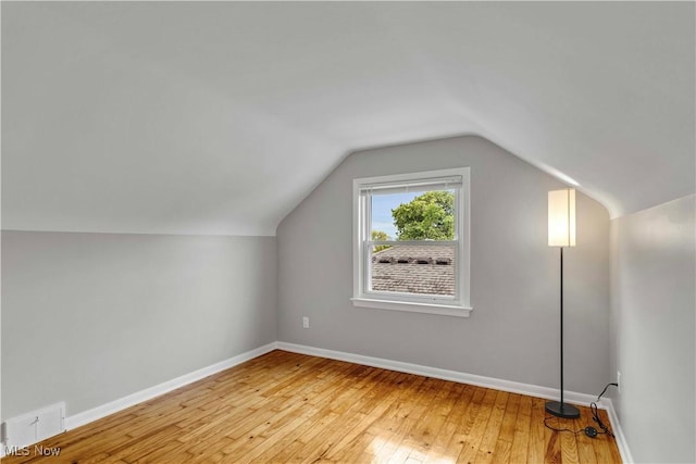 6207 Dartworth Dr, Parma, OH 44129 - additional living space featuring light wood-type flooring and lofted ceiling