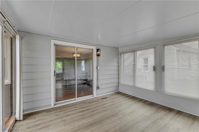 6207 Dartworth Dr, Parma, OH 44129 - unfurnished sunroom featuring a chandelier