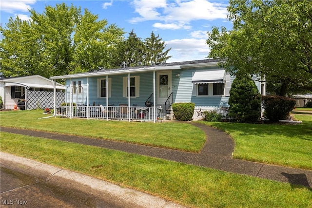 8 Symphony St, Olmsted Twp, OH 44138 - view of front of home featuring a porch, a front yard, and a carport