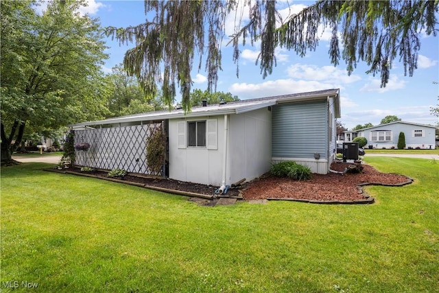 8 Symphony St, Olmsted Twp, OH 44138 - view of side of property with a lawn