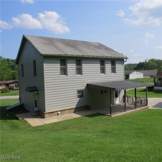 399 N Main St, Amsterdam, OH 43903 - rear view of house with a yard and a shingled roof